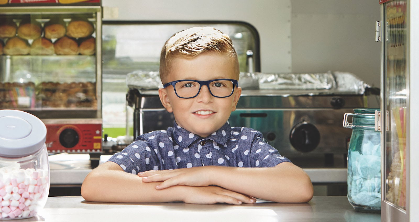 Child trying on glasses during an eye test