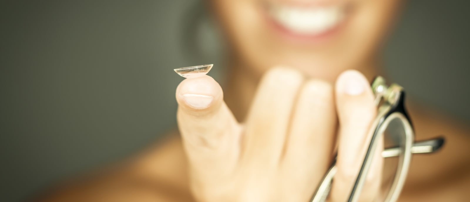 Close-up of a contact lens on a fingertip